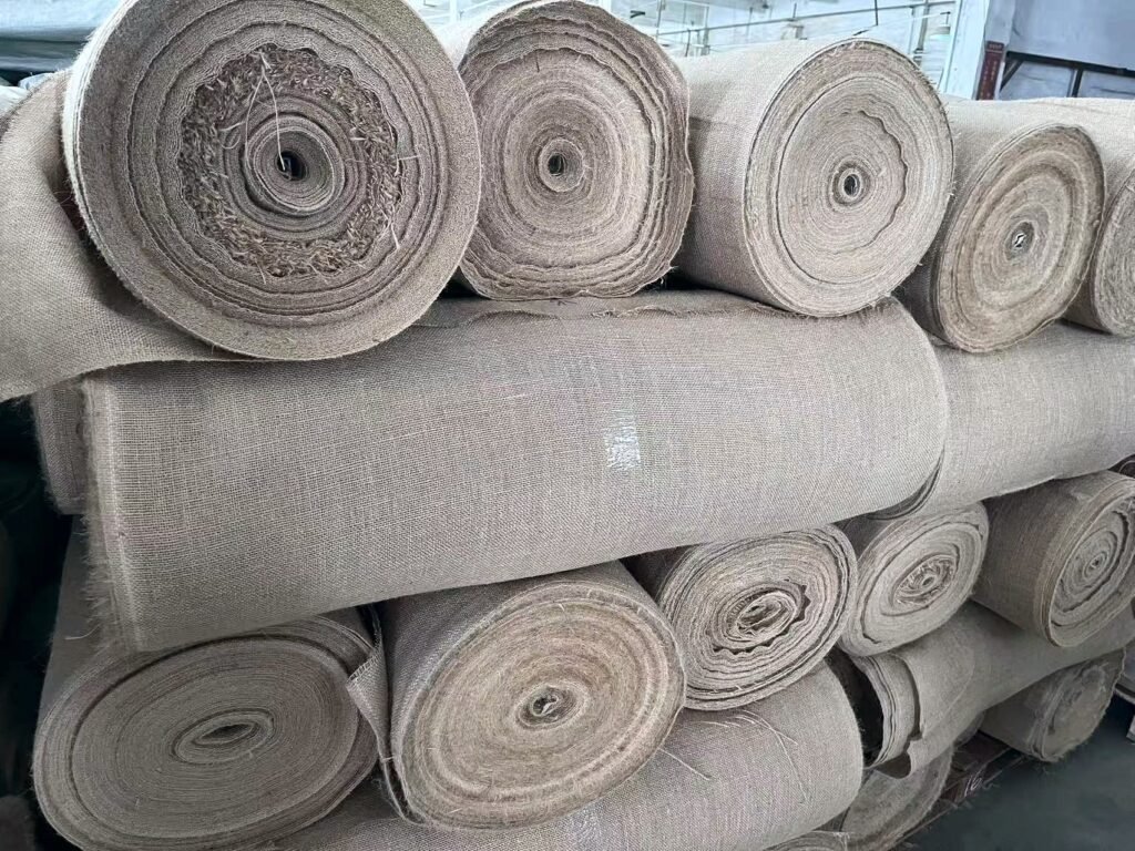 Stacked rolls of jute fabric